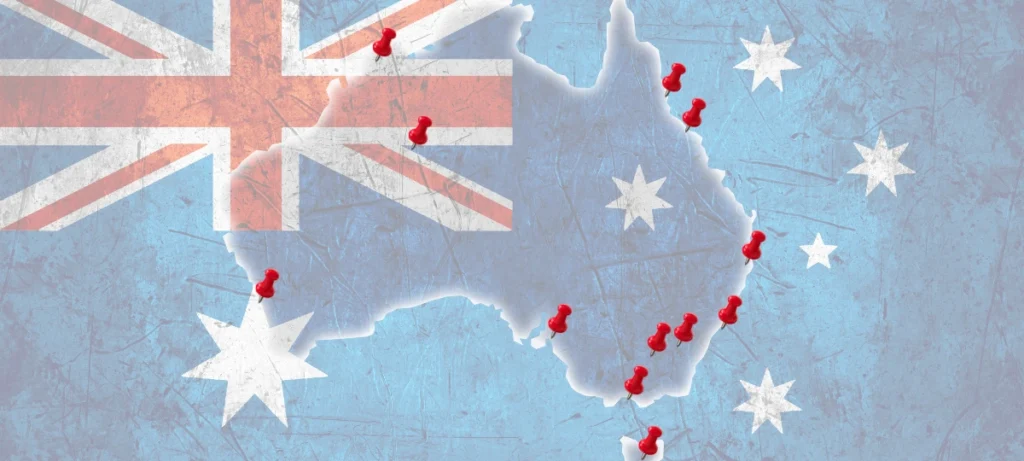 A map of Australia in the colours of the Australian flag with red pins showing Dogtainers office locations.