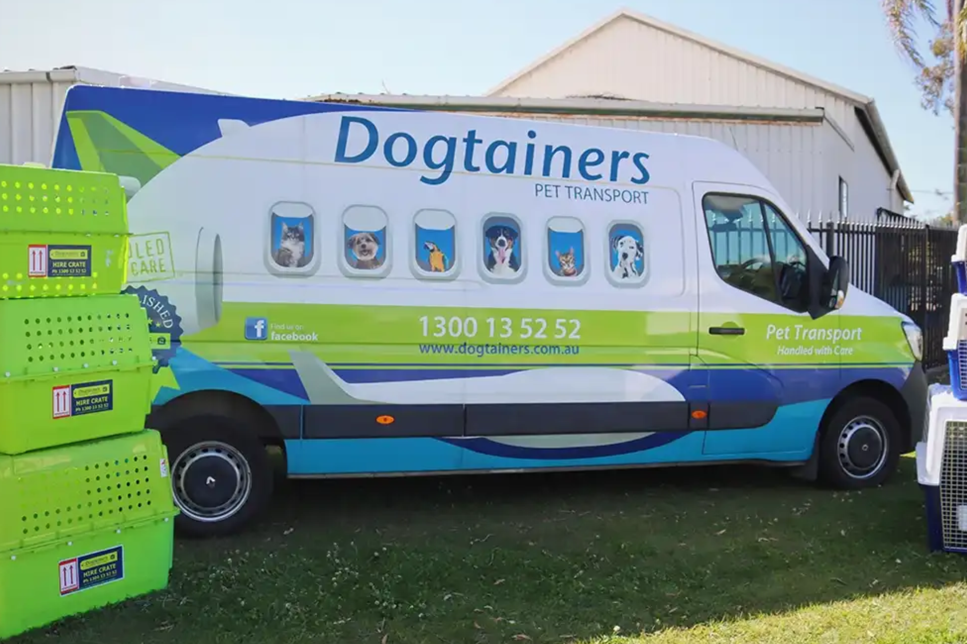 dogtainers van on grass with green crates